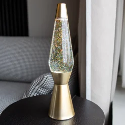 Lámpara de Lava 'Bullet' con base oro mate, líquido transparente y lava purpurina oro