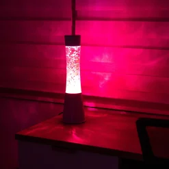 Lámpara de lava con purpurina de corazones con base blanca y líquido rosa